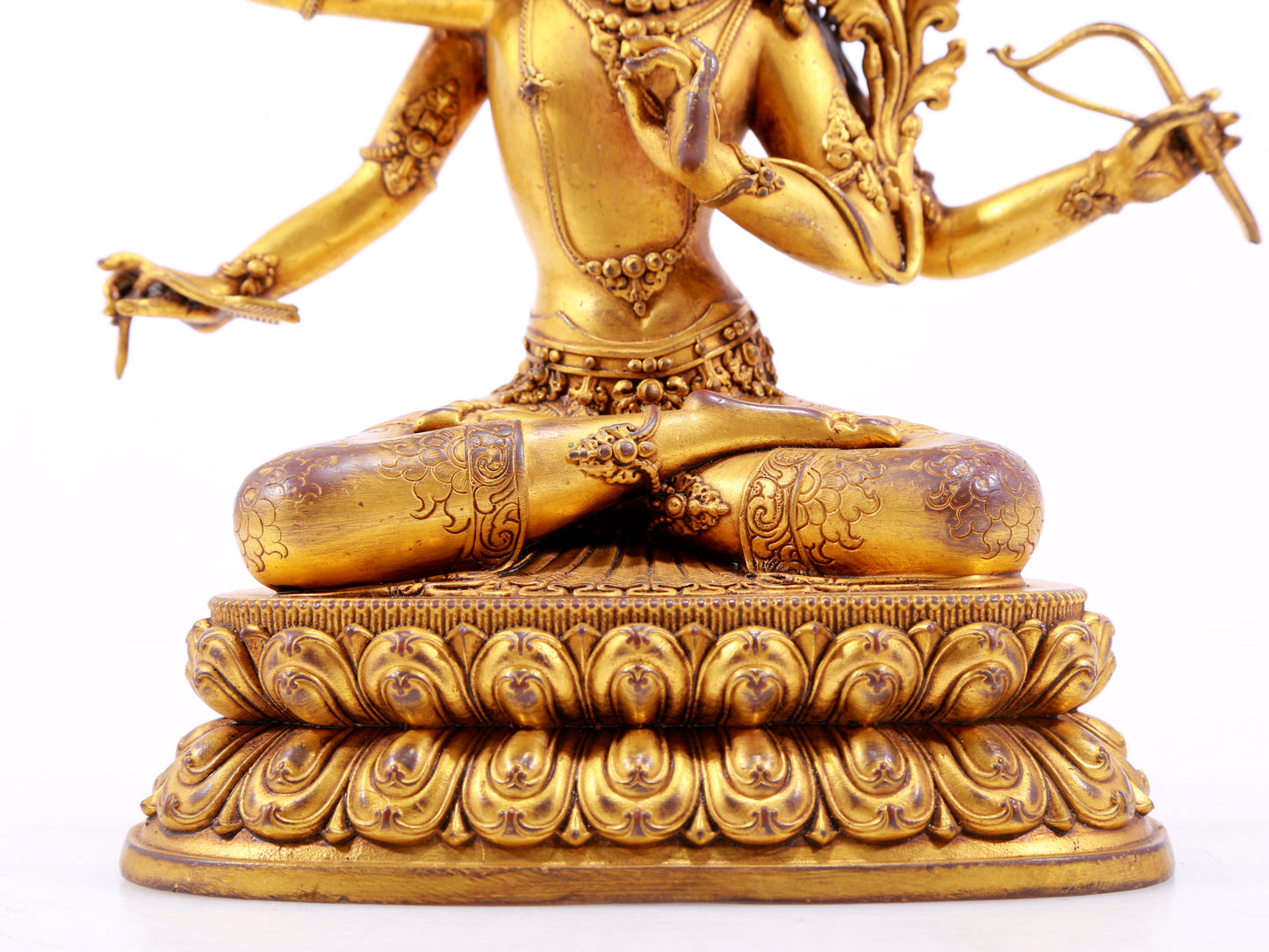 A majestic gilt bronze four-armed Manjushri statue with inscription