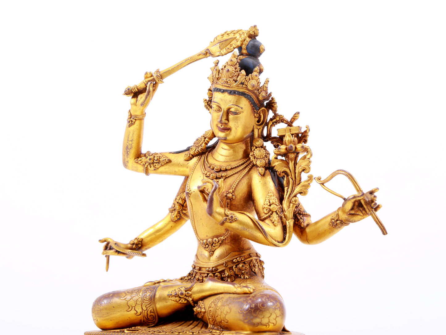 A majestic gilt bronze four-armed Manjushri statue with inscription