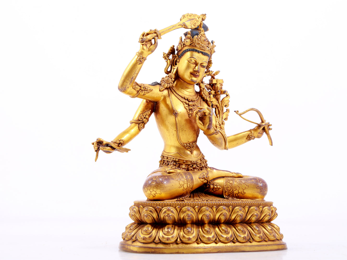 A majestic gilt bronze four-armed Manjushri statue with inscription