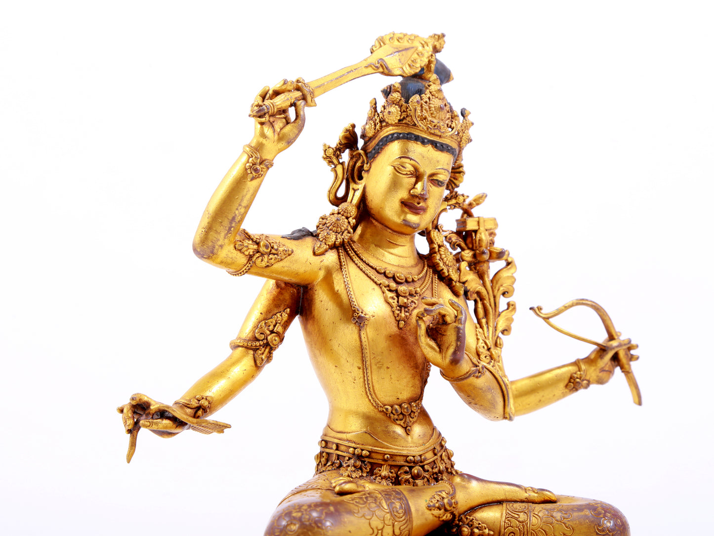 A majestic gilt bronze four-armed Manjushri statue with inscription