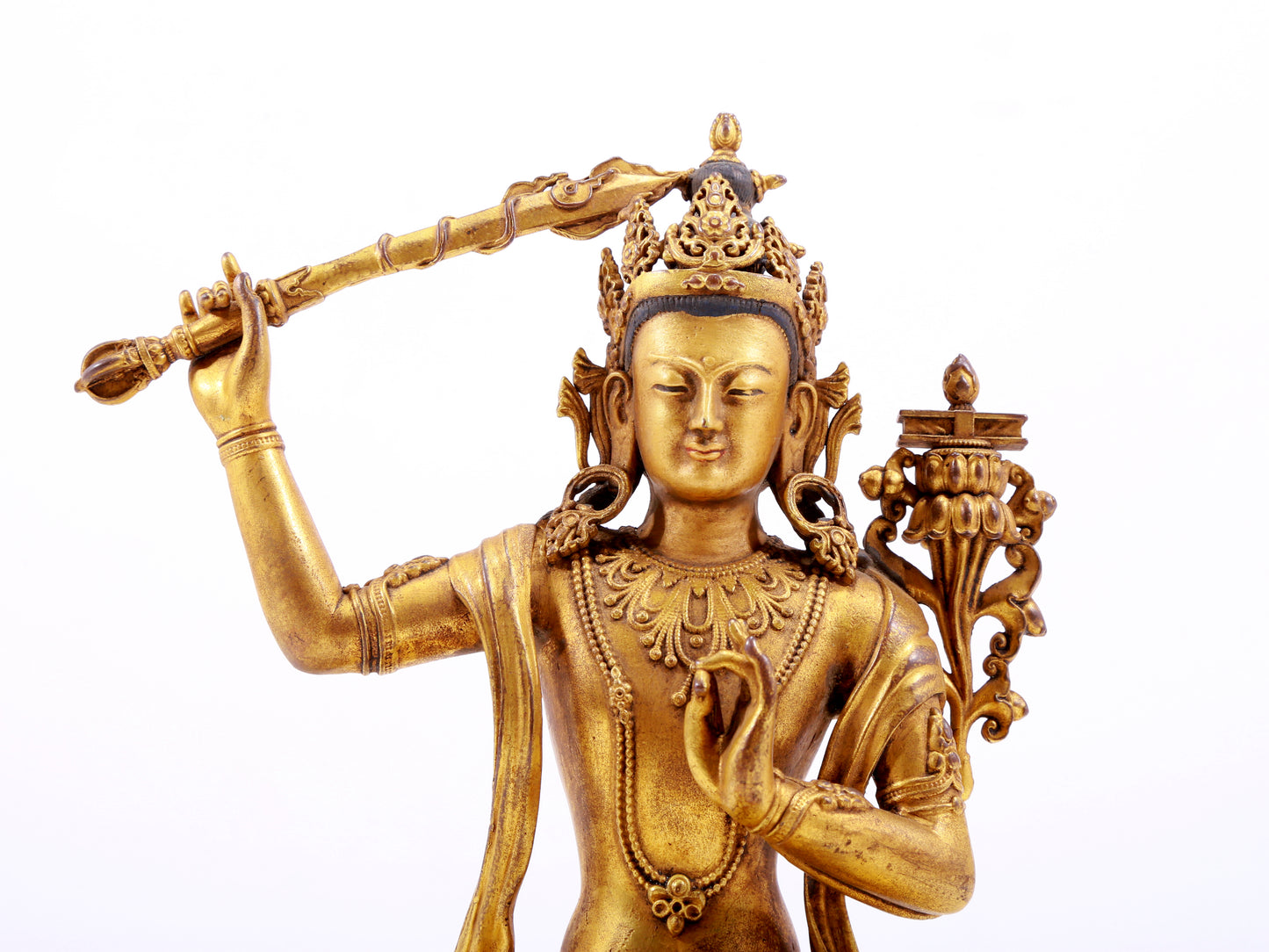 A majestic gilt bronze statue of Manjusri Bodhisattva