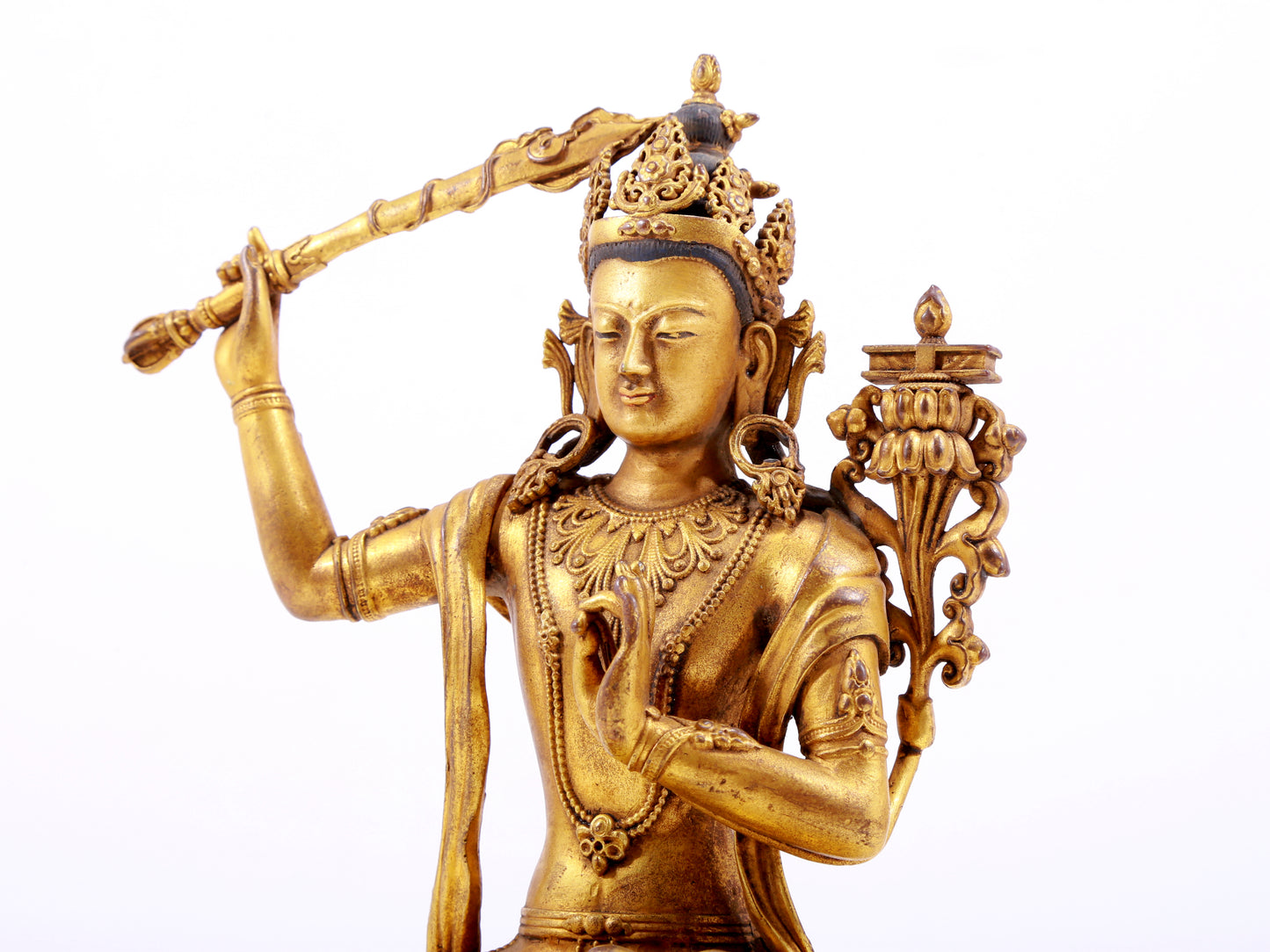 A majestic gilt bronze statue of Manjusri Bodhisattva