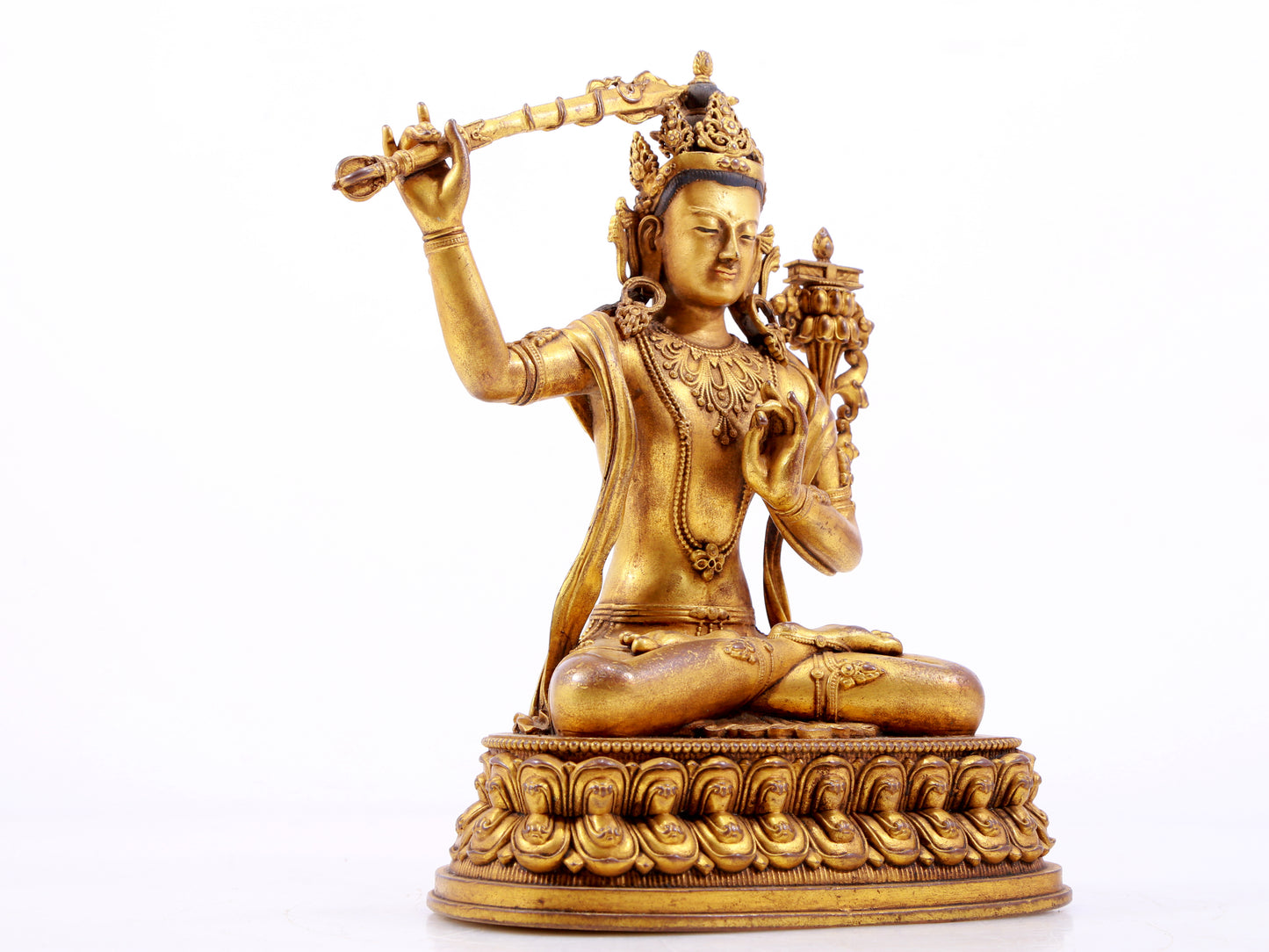 A majestic gilt bronze statue of Manjusri Bodhisattva