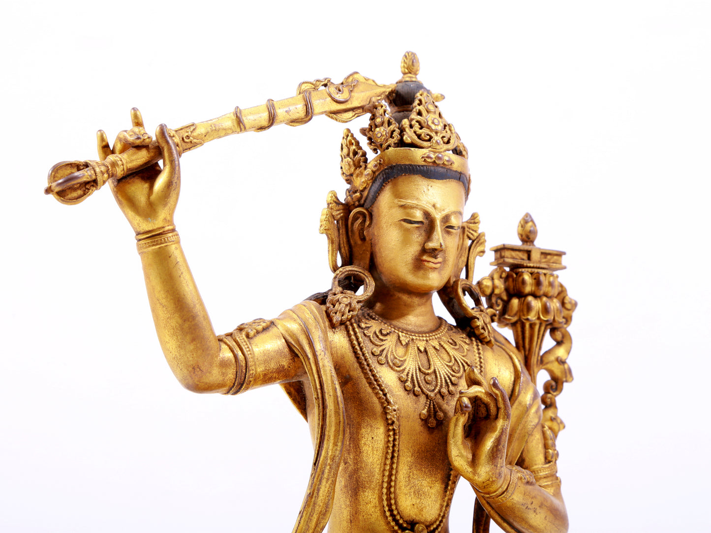 A majestic gilt bronze statue of Manjusri Bodhisattva