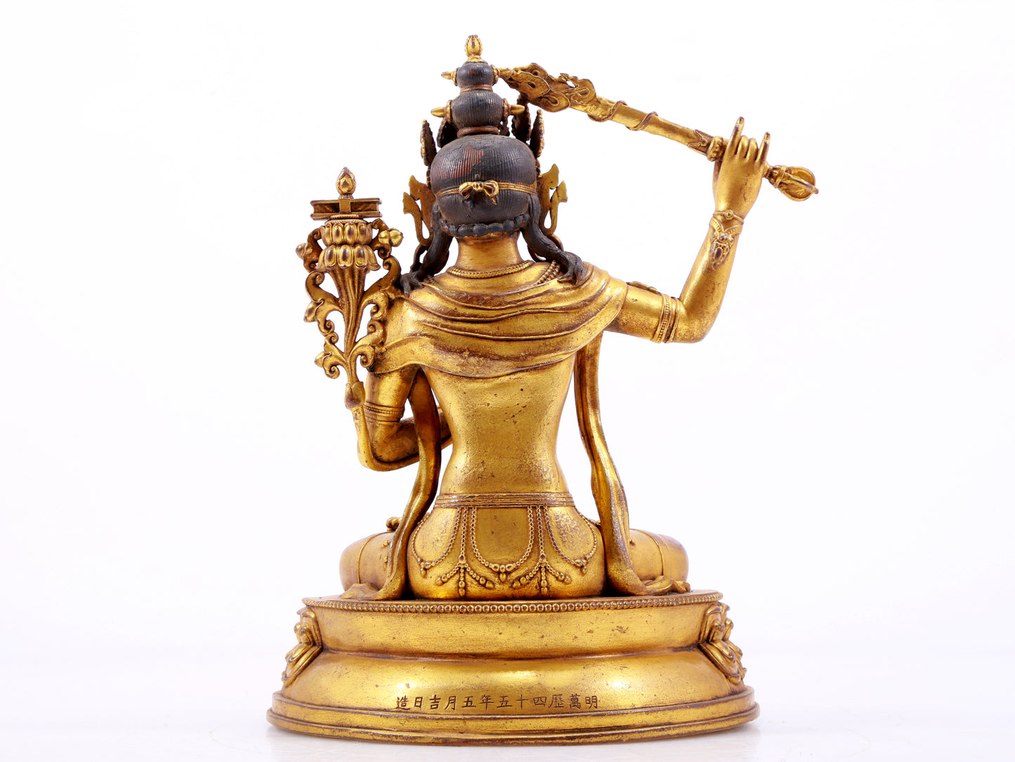 A majestic gilt bronze statue of Manjusri Bodhisattva