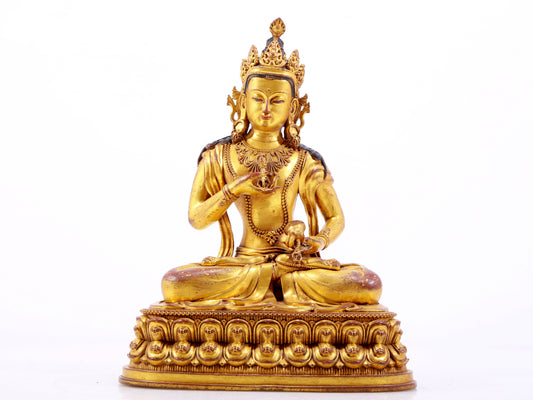 A solemn gilt bronze statue of Vajrasattva