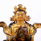 A solemn gilt bronze statue of the Guru