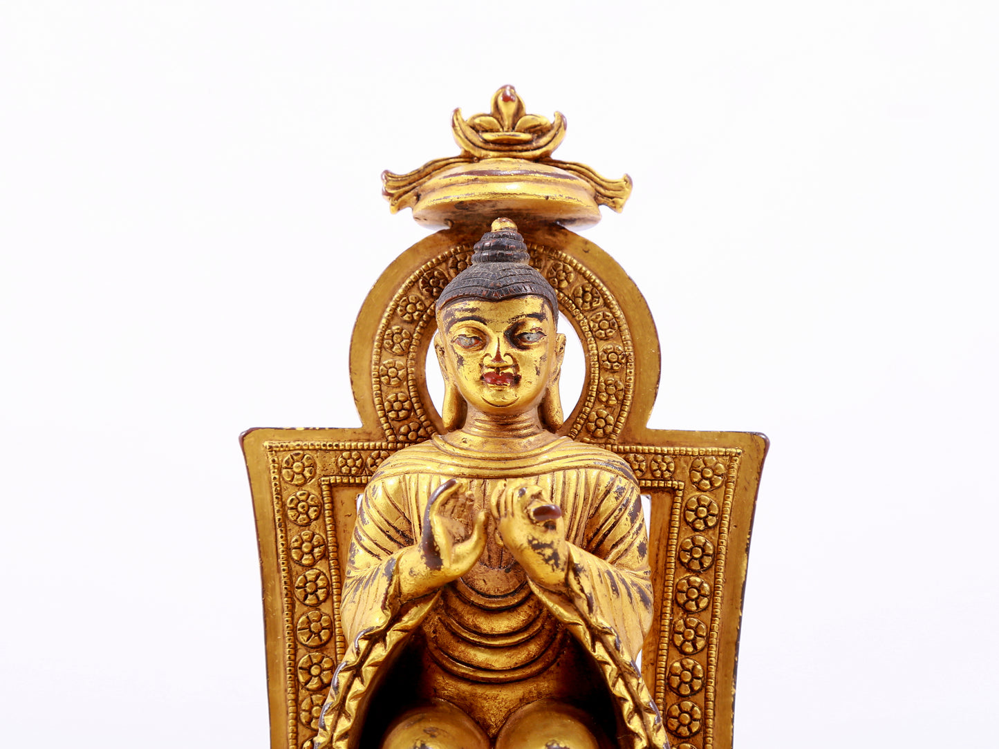 A majestic gilt bronze statue of Sakyamuni