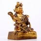 A solemn gilt bronze statue of the Guru