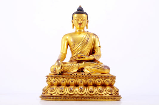 A majestic gilt bronze statue of Sakyamuni