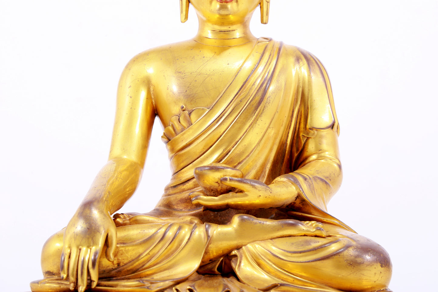 A majestic gilt bronze statue of Sakyamuni