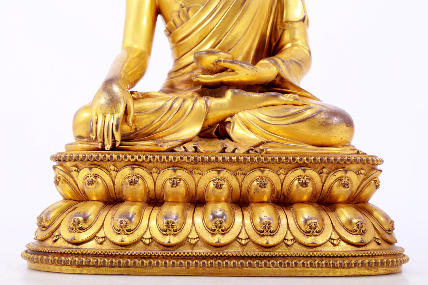 A majestic gilt bronze statue of Sakyamuni