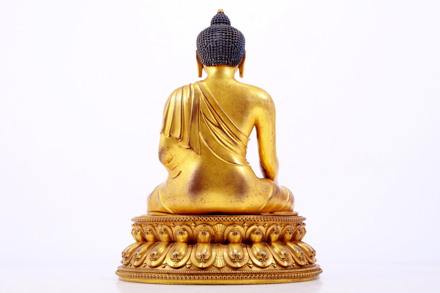 A majestic gilt bronze statue of Sakyamuni