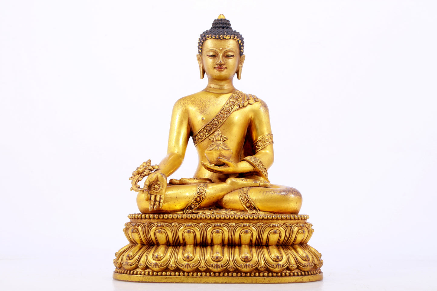 A majestic gilt bronze statue of Sakyamuni