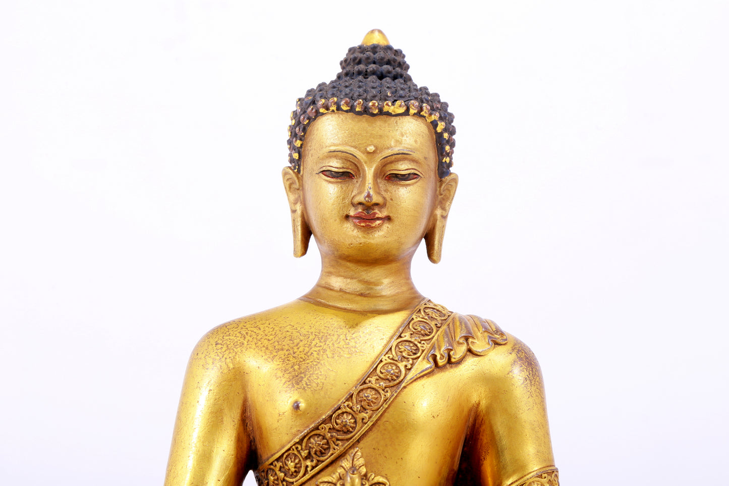 A majestic gilt bronze statue of Sakyamuni