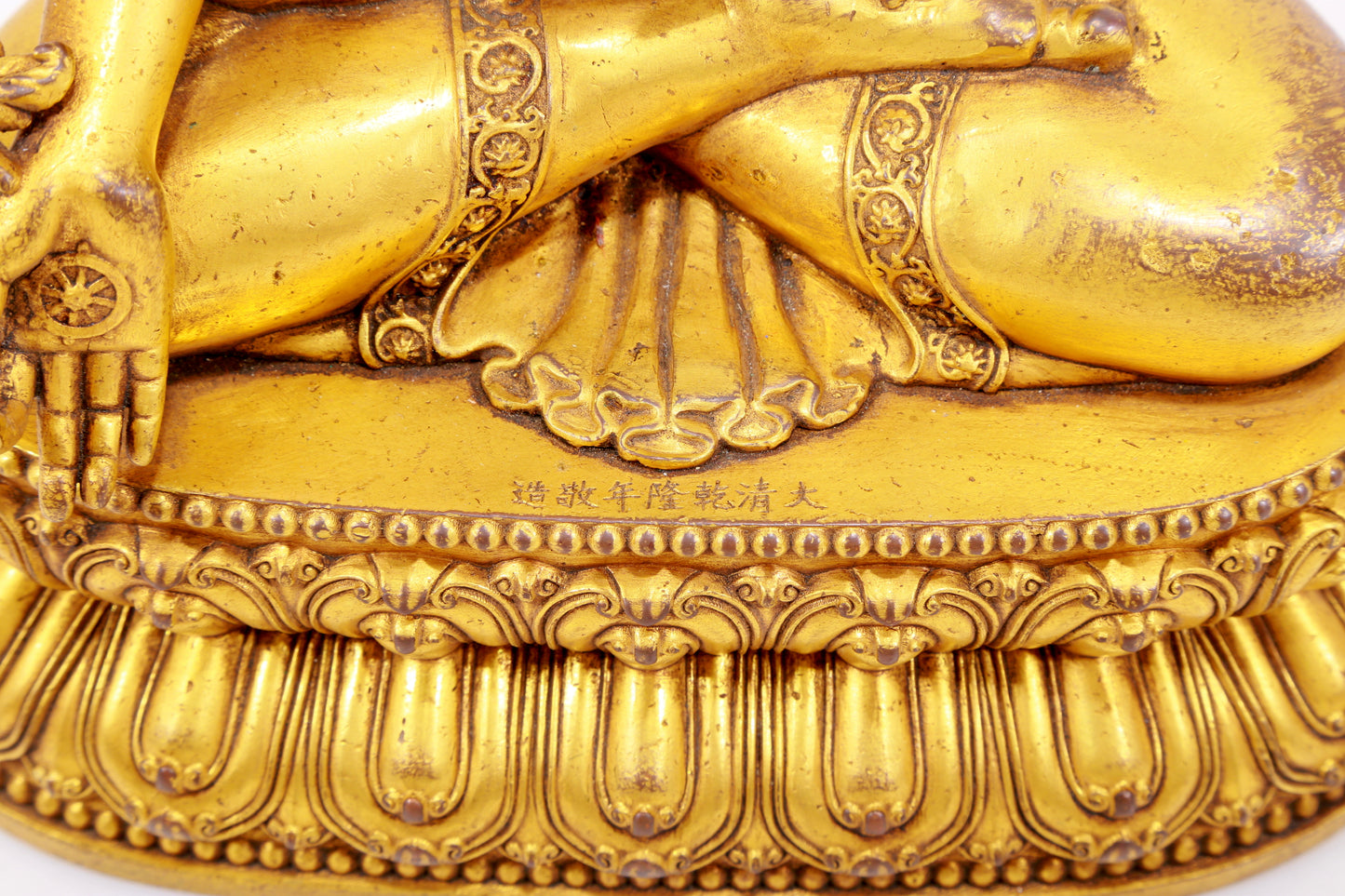 A majestic gilt bronze statue of Sakyamuni