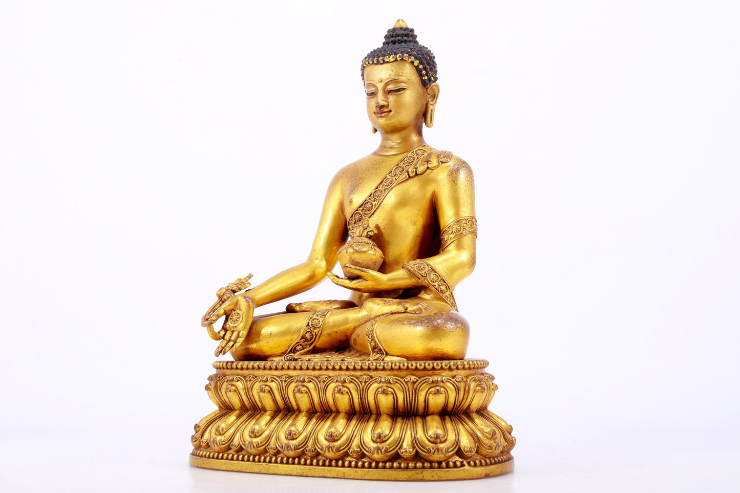 A majestic gilt bronze statue of Sakyamuni