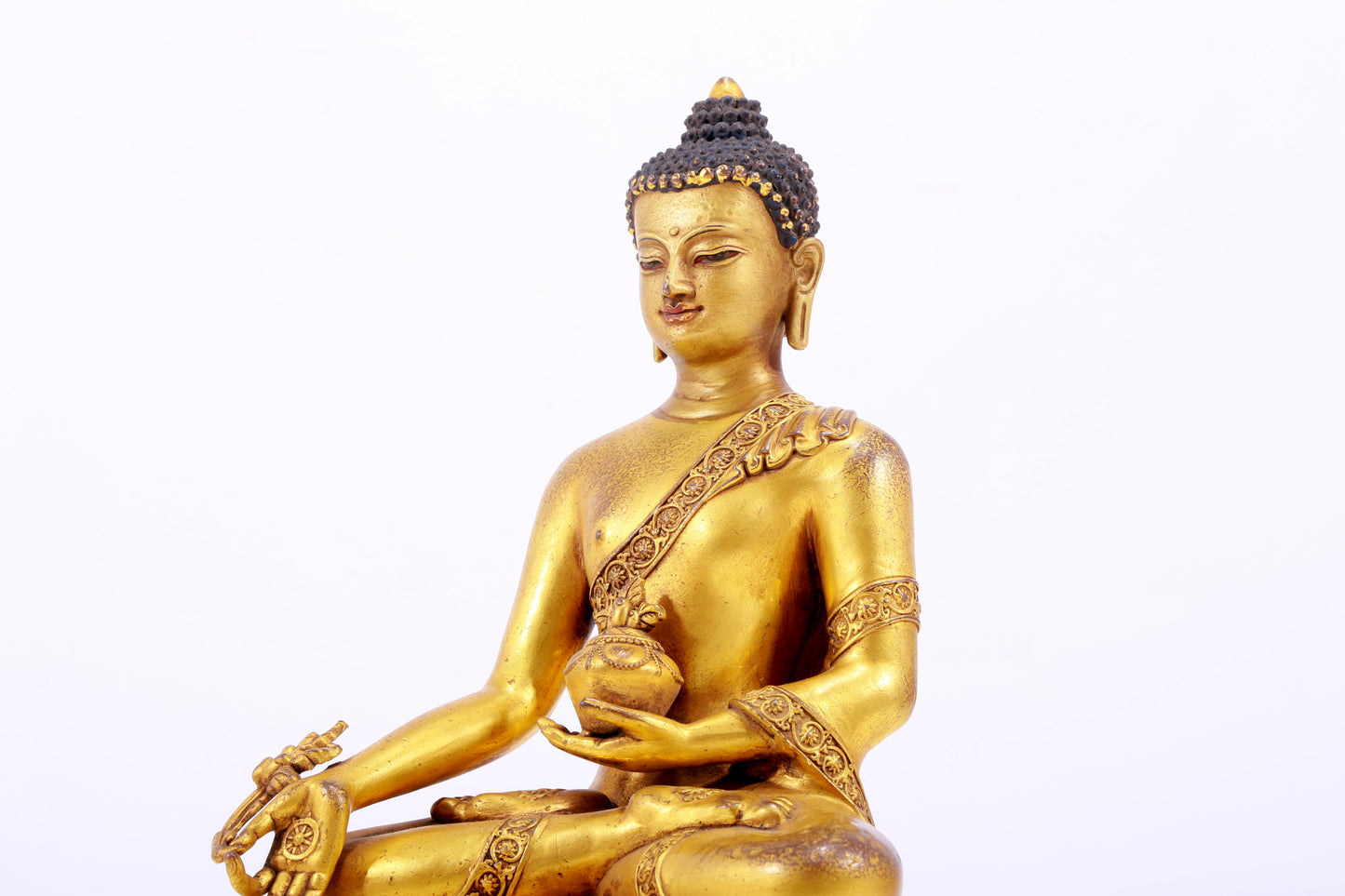 A majestic gilt bronze statue of Sakyamuni