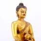 A majestic gilt bronze statue of Sakyamuni