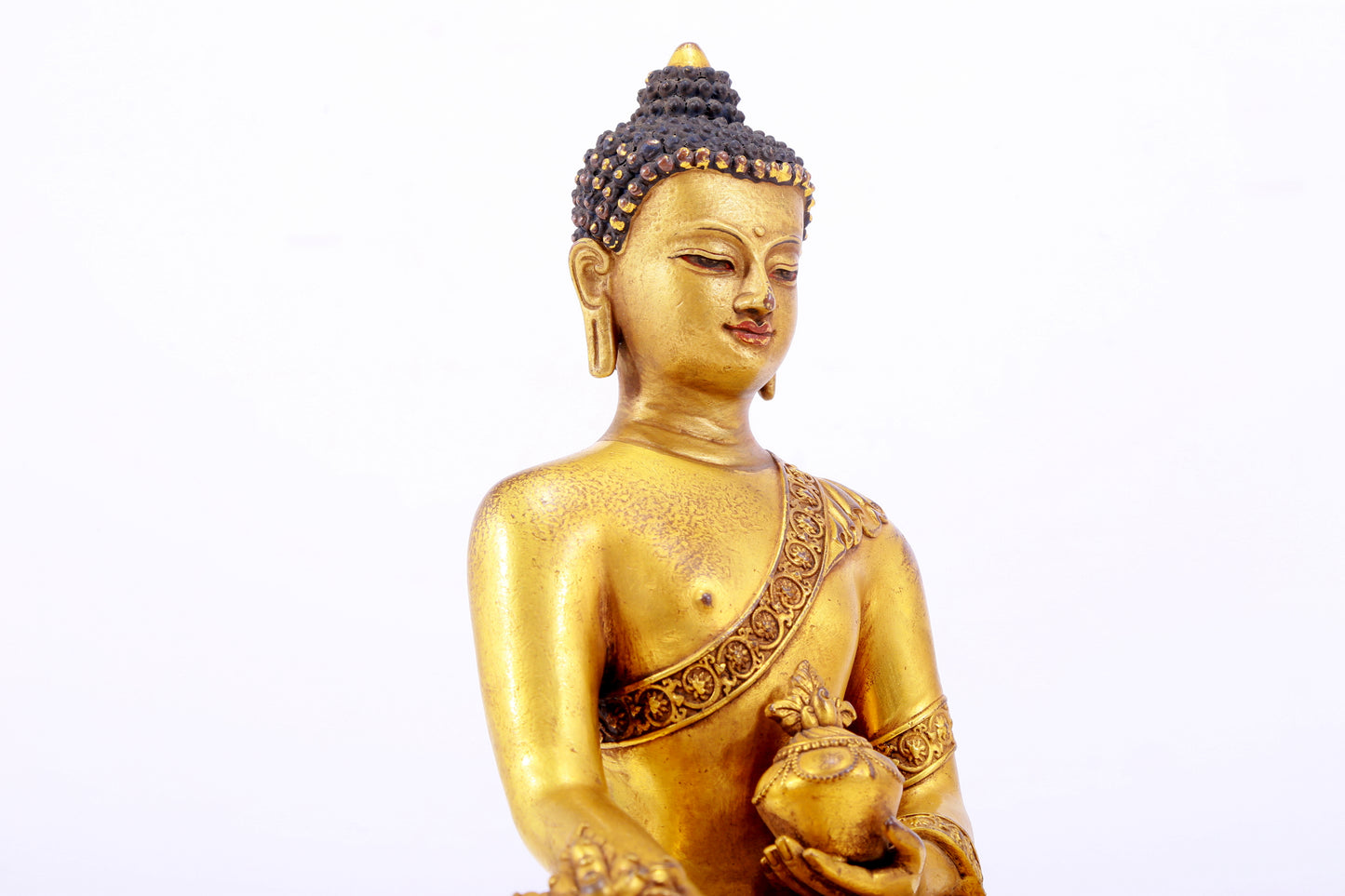 A majestic gilt bronze statue of Sakyamuni