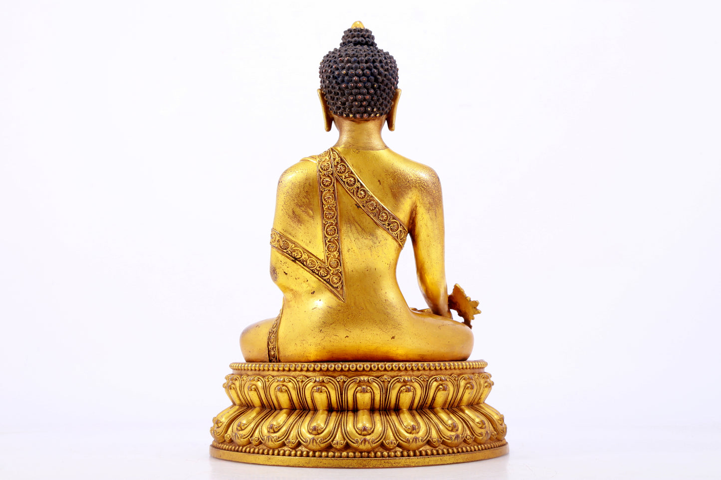 A majestic gilt bronze statue of Sakyamuni