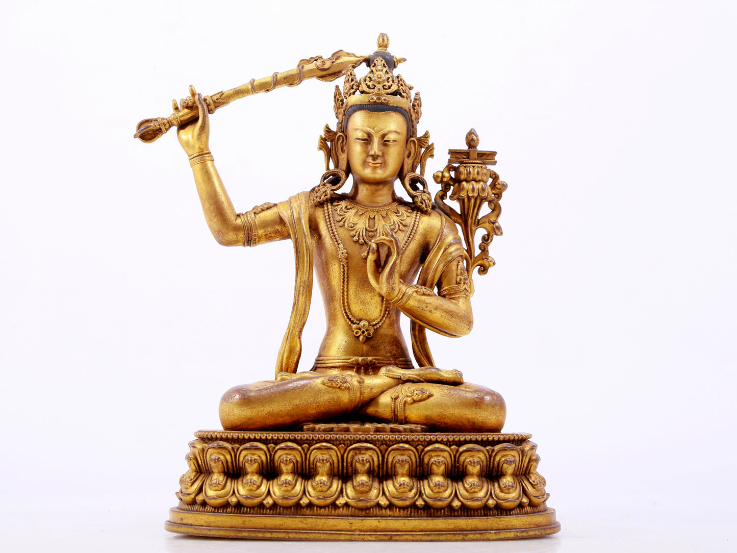 A majestic gilt bronze statue of Manjusri Bodhisattva