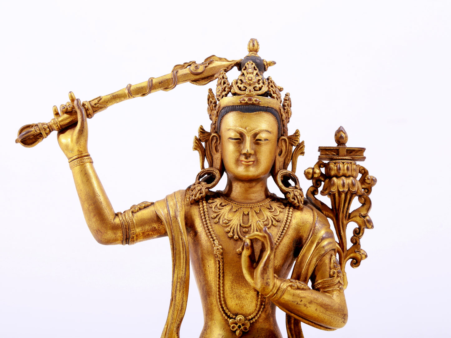 A majestic gilt bronze statue of Manjusri Bodhisattva