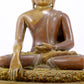 A solemn alloy copper statue of Gautama Buddha