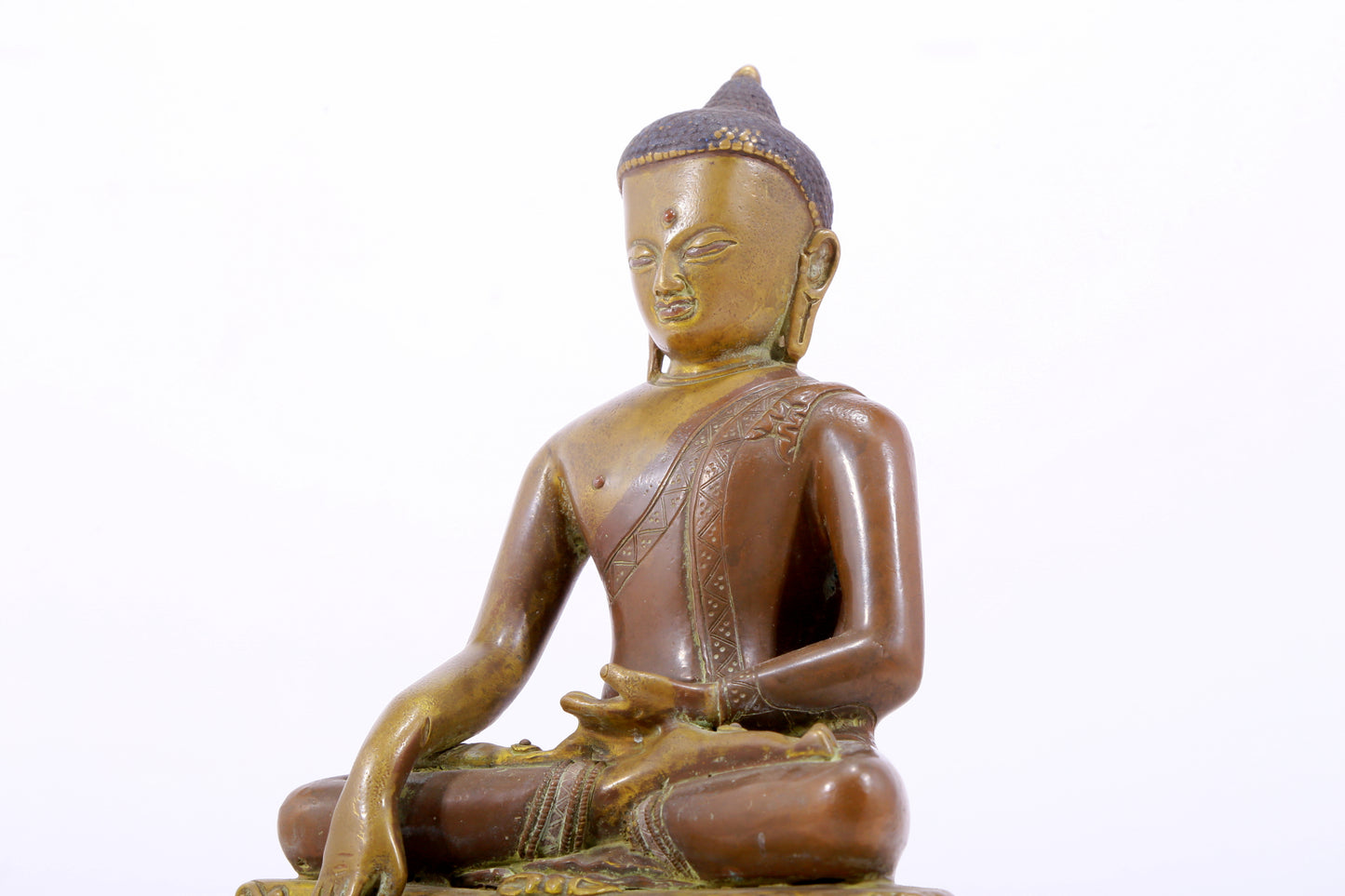 A solemn alloy copper statue of Gautama Buddha