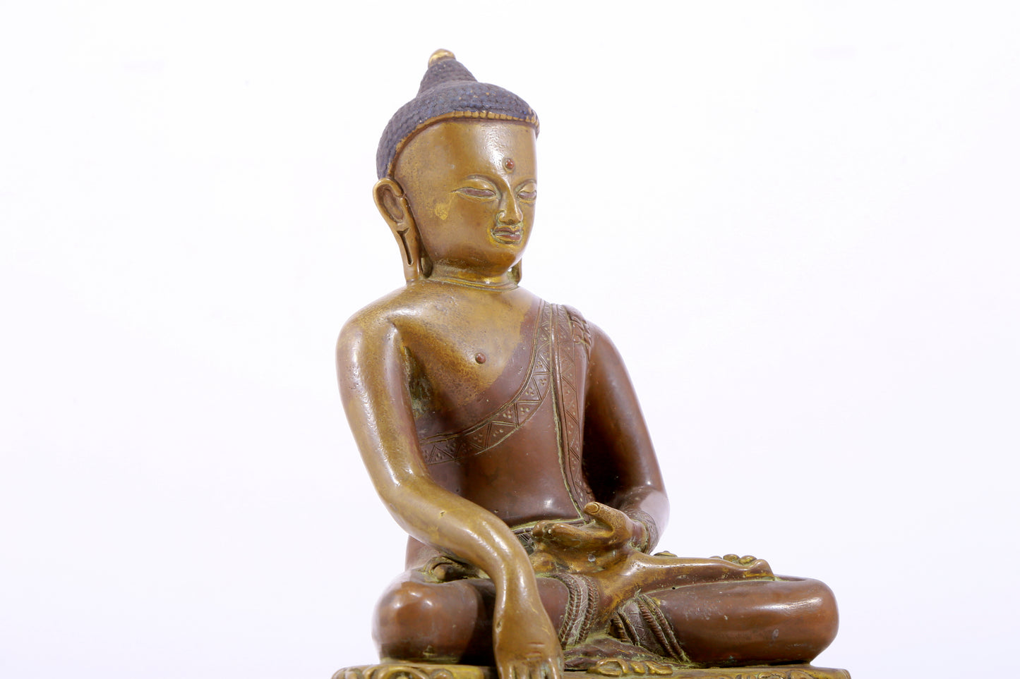 A solemn alloy copper statue of Gautama Buddha