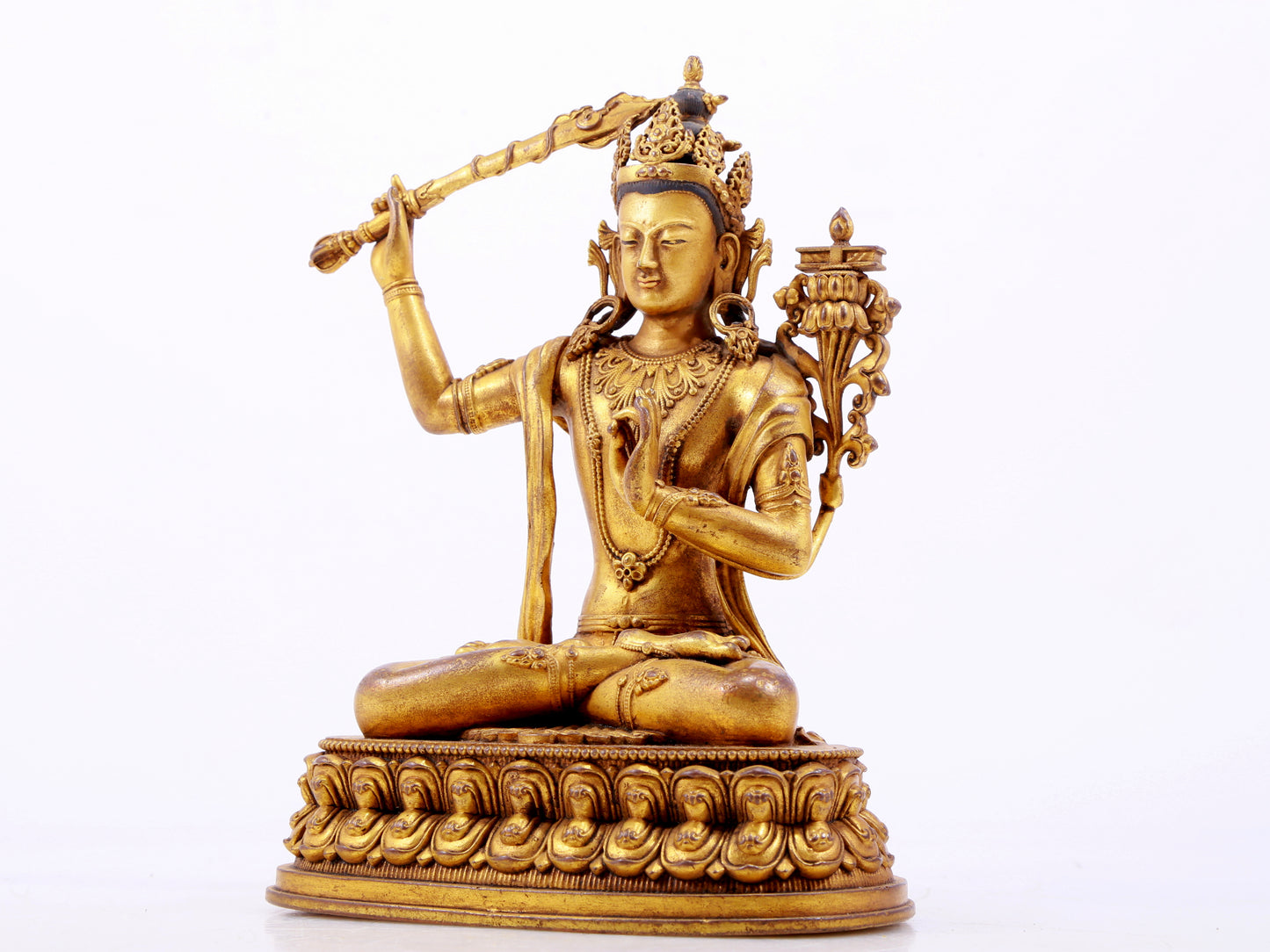 A majestic gilt bronze statue of Manjusri Bodhisattva