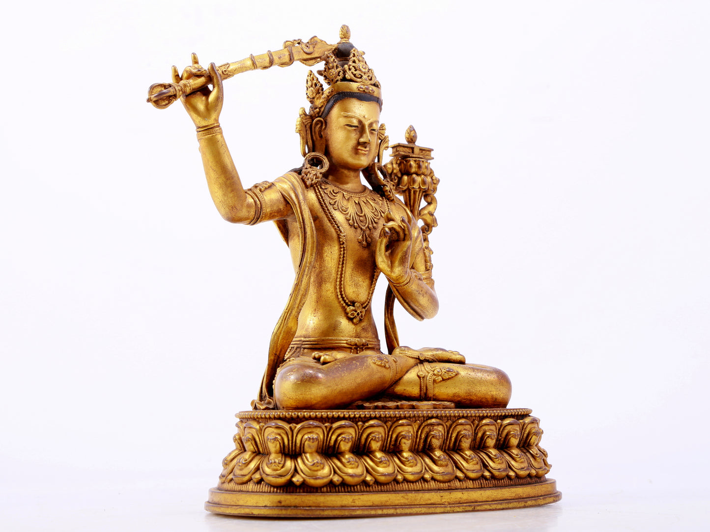 A majestic gilt bronze statue of Manjusri Bodhisattva