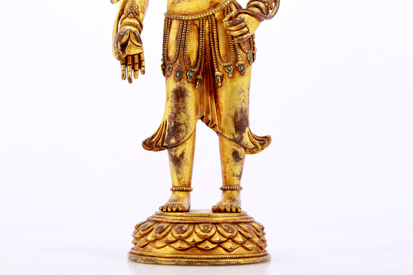 majestic gilt bronze statue of Tara inlaid with turquoise