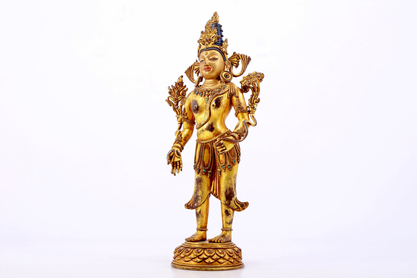 majestic gilt bronze statue of Tara inlaid with turquoise