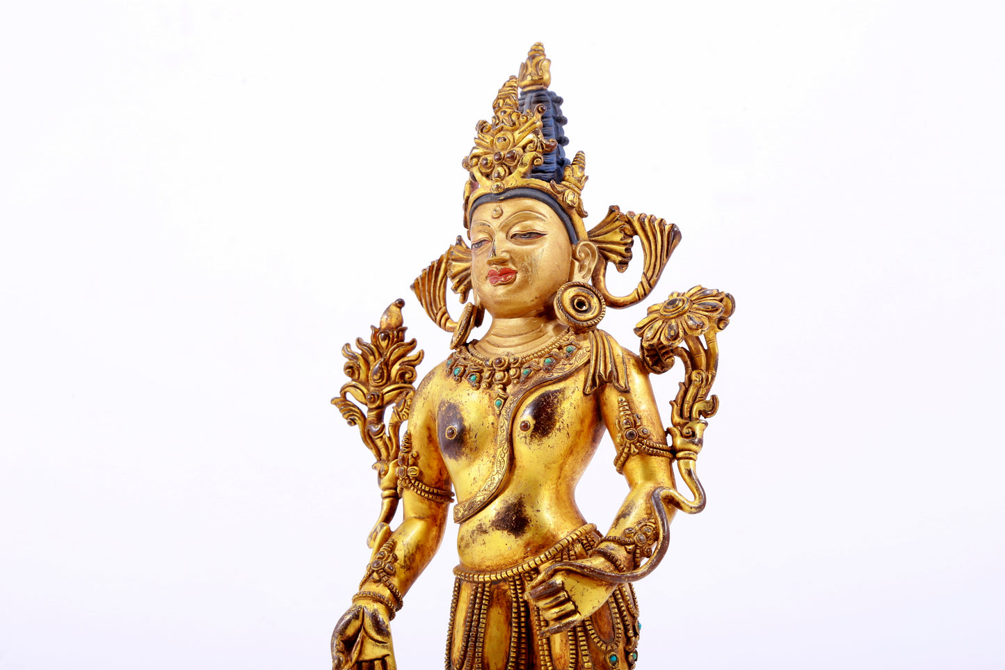 majestic gilt bronze statue of Tara inlaid with turquoise