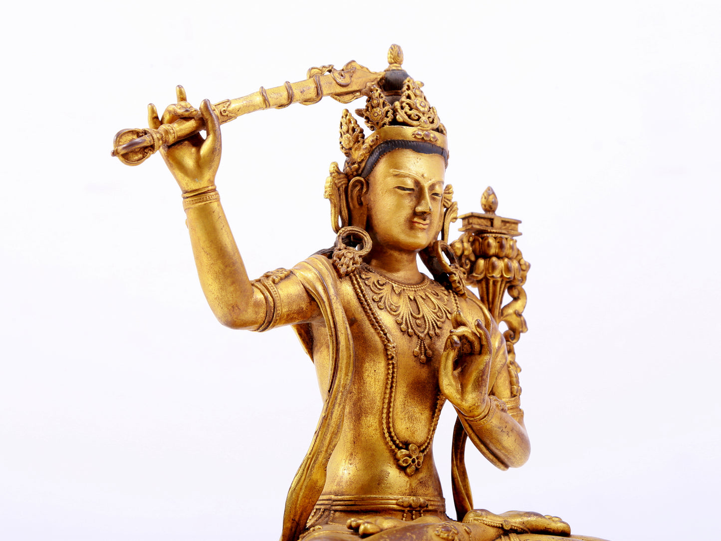 A majestic gilt bronze statue of Manjusri Bodhisattva