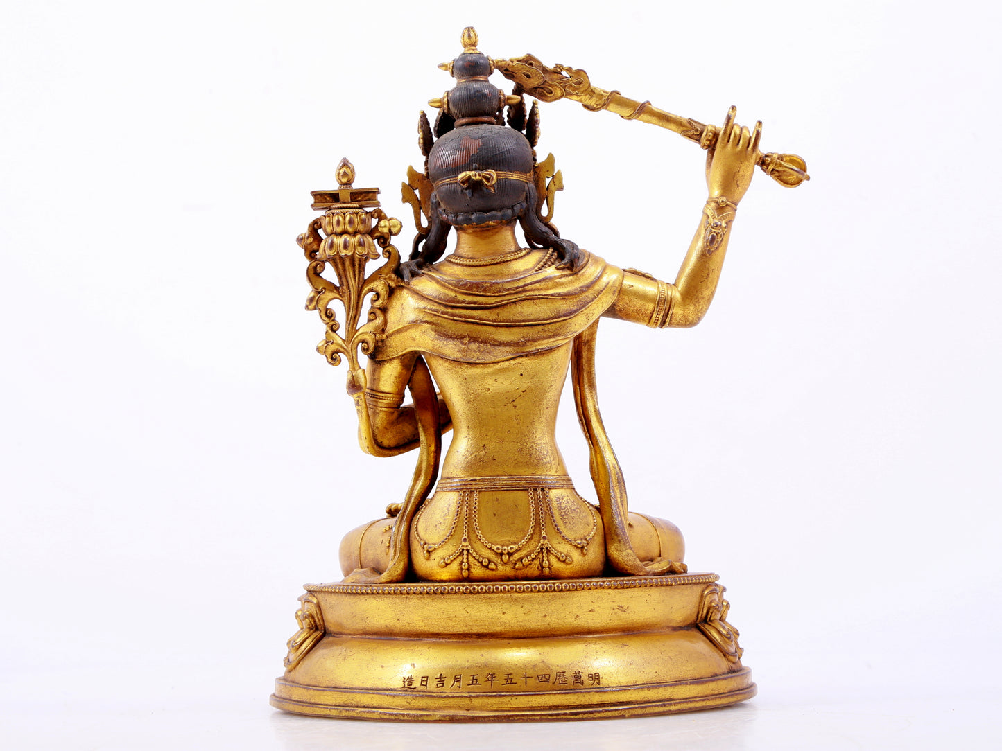 A majestic gilt bronze statue of Manjusri Bodhisattva