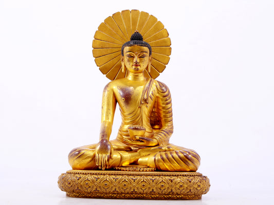 A majestic gilt bronze statue of Sakyamuni