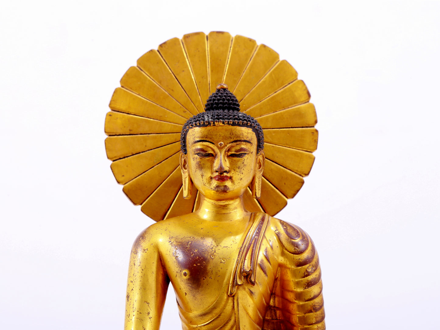 A majestic gilt bronze statue of Sakyamuni