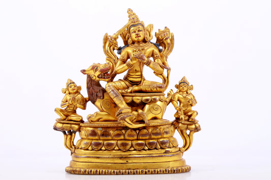 A majestic gilt bronze statue of Manjusri Bodhisattva