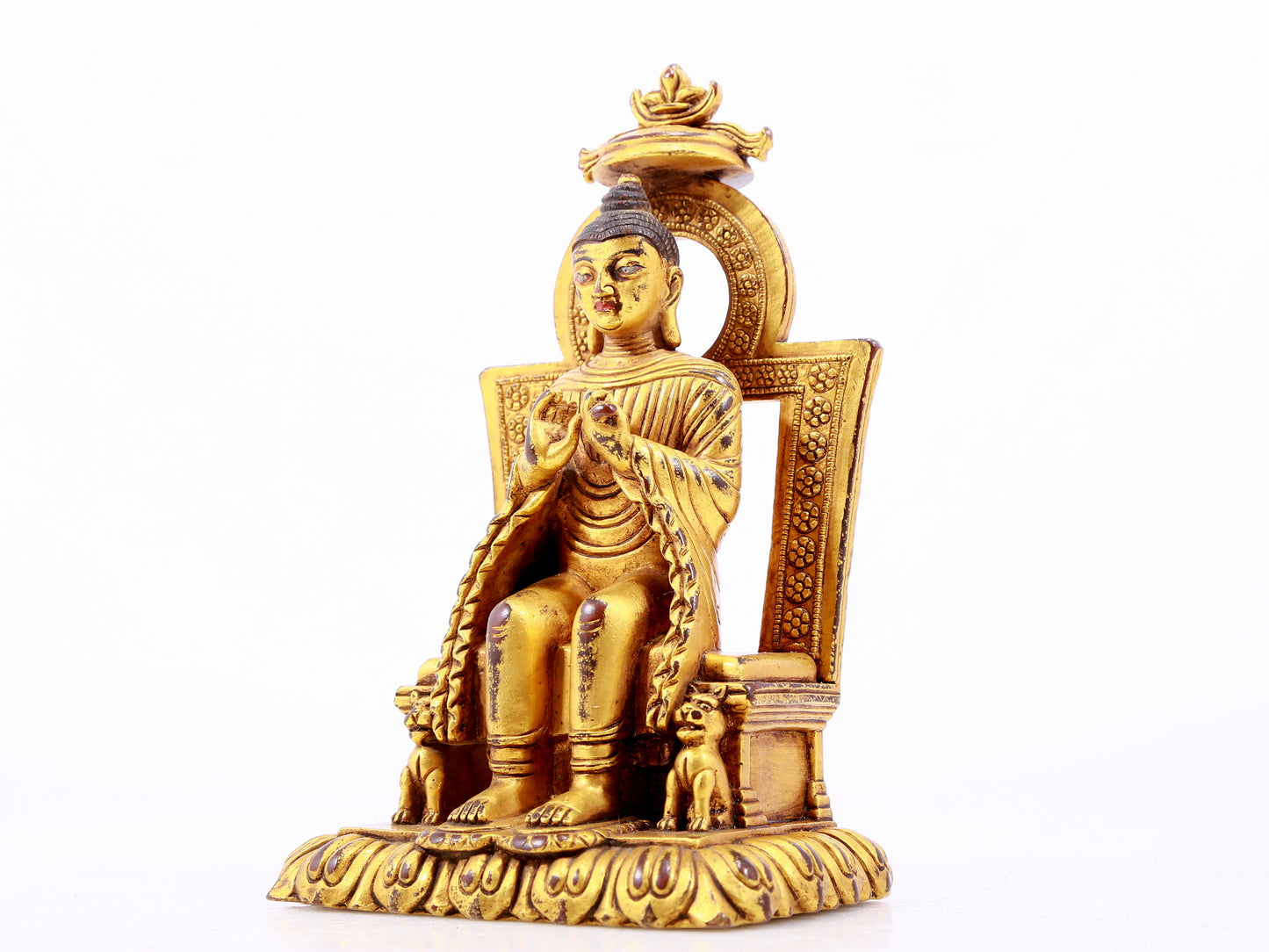 A majestic gilt bronze statue of Sakyamuni