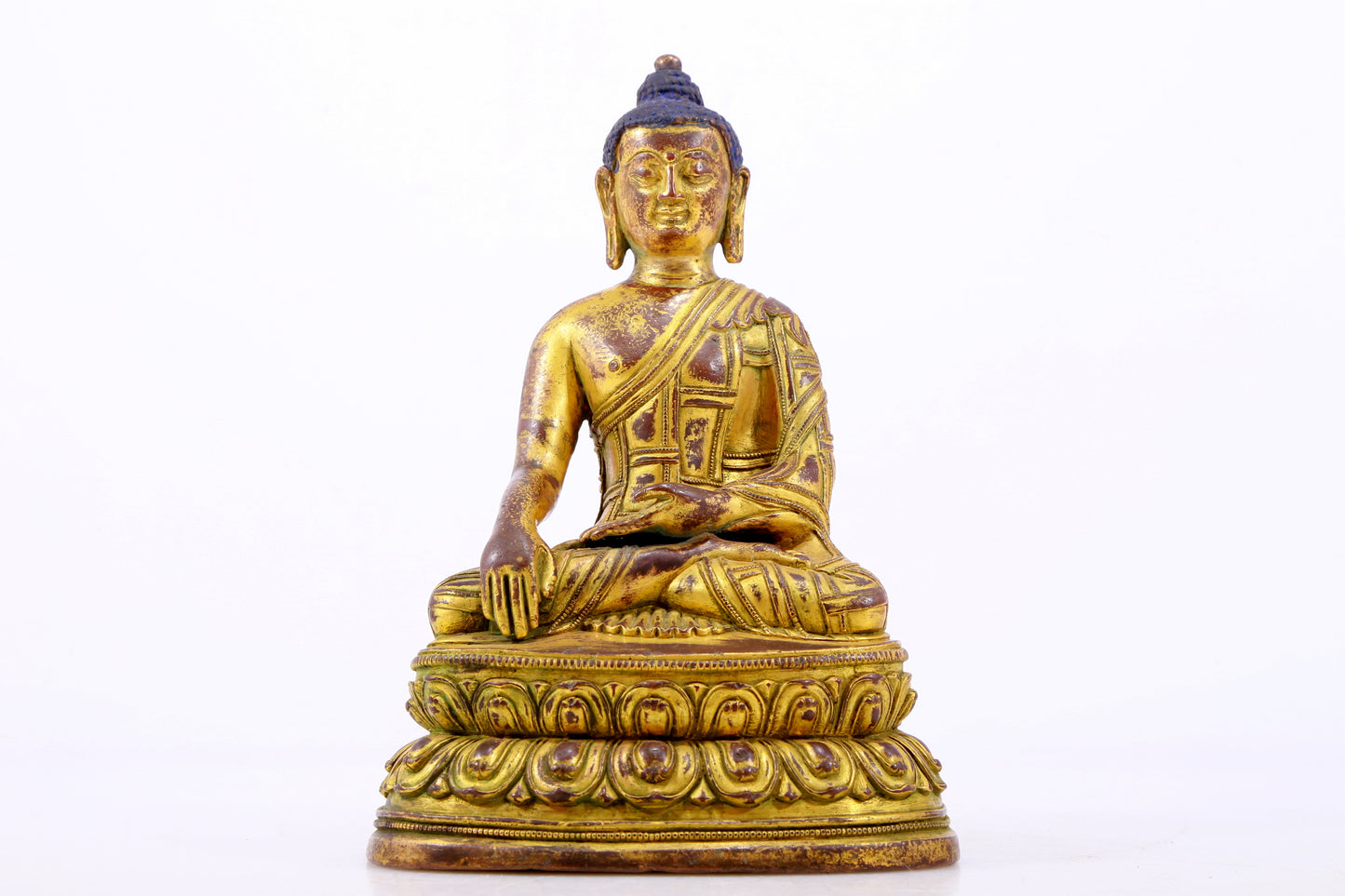 A majestic gilt bronze statue of Sakyamuni