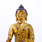 A majestic gilt bronze statue of Sakyamuni