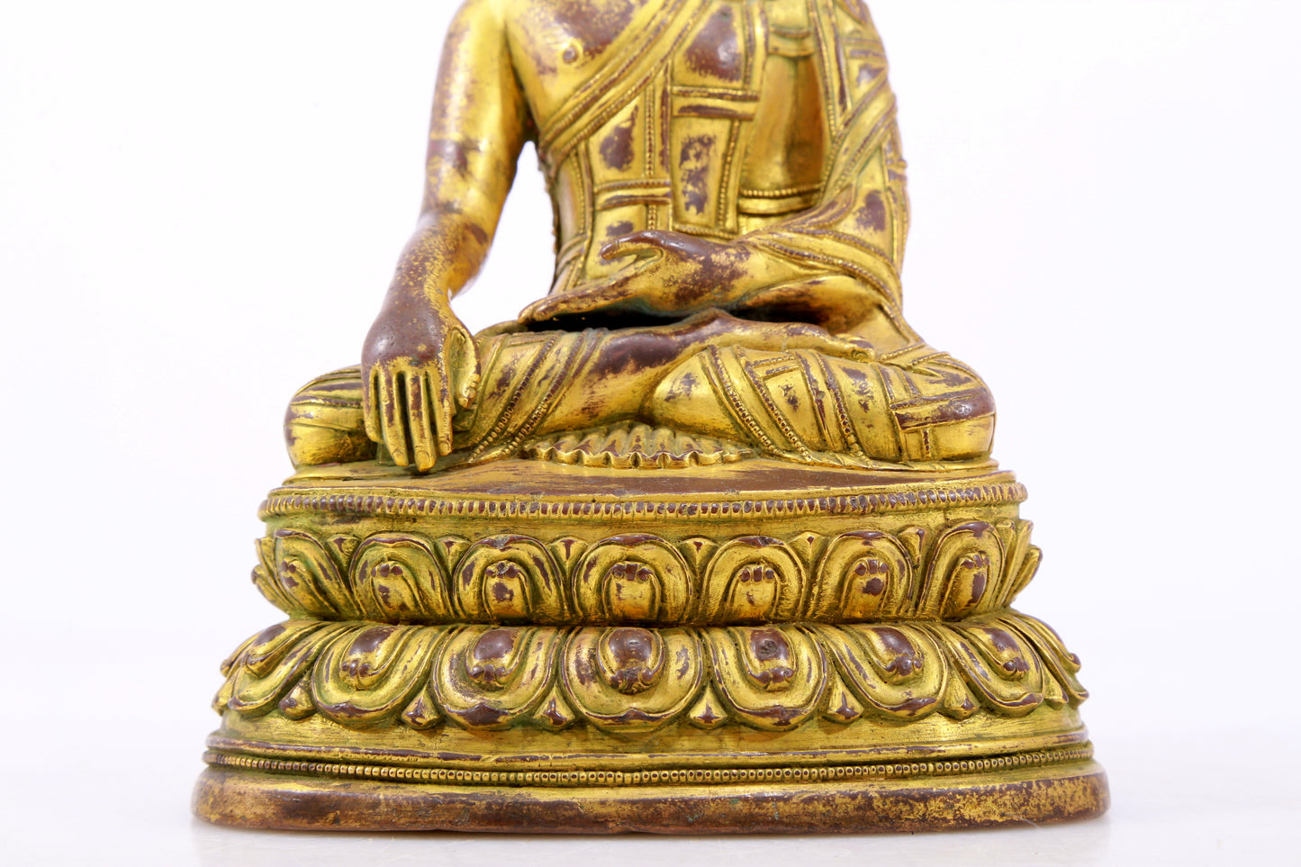 A majestic gilt bronze statue of Sakyamuni