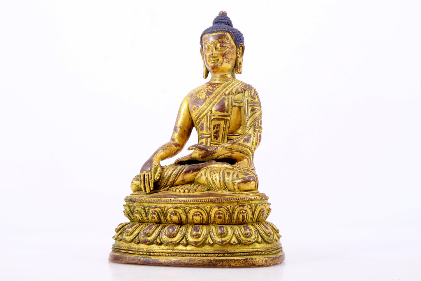 A majestic gilt bronze statue of Sakyamuni