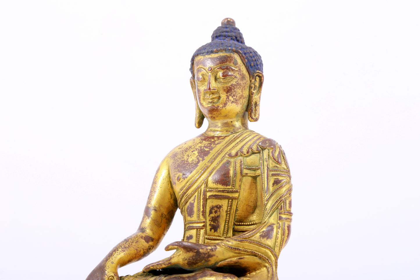 A majestic gilt bronze statue of Sakyamuni