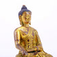 A majestic gilt bronze statue of Sakyamuni