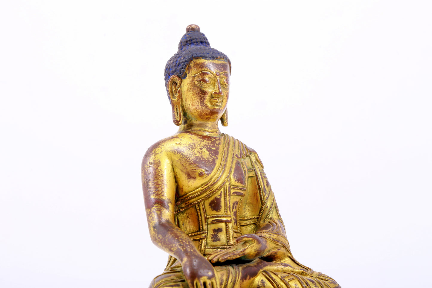 A majestic gilt bronze statue of Sakyamuni