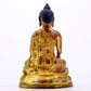 A majestic gilt bronze statue of Sakyamuni