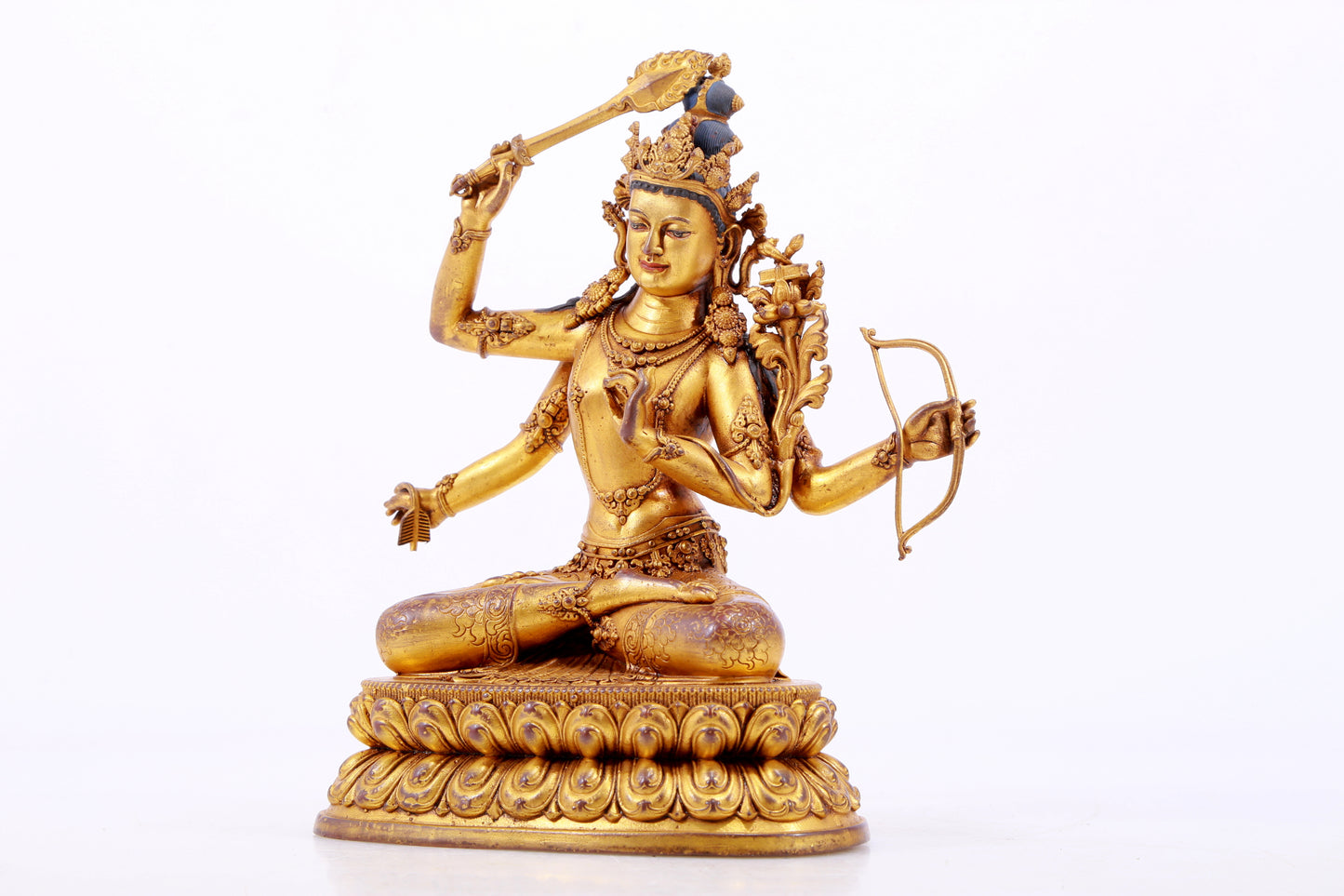 A majestic gilt bronze statue of Manjusri Bodhisattva